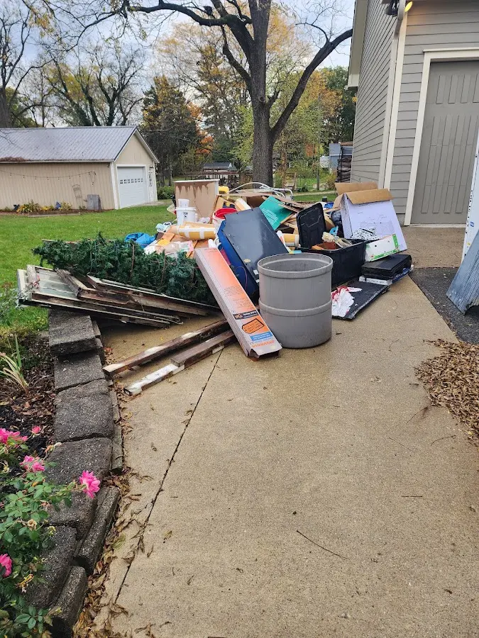 Dumpster being loaded with debris for 3 Yard Dumpster Rental in Cocoa